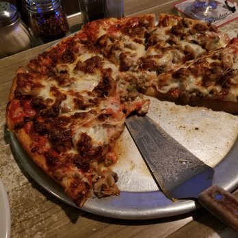 Pat Dees Pub & Eatery - This pizza looked so good, we ate a piece before the picture. So good!! - Pubs Near Me - Northfield, Ohio