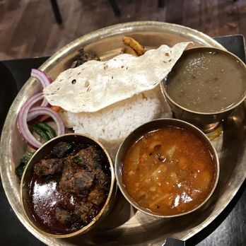 Himalayan Yak - Dish Name: Nepali Kitchen with Goat Curry $17. Served with Rice, Daal, Mustard green, Veg Curry of day, Papad, Achar. - Himalayan/Nepalese Near Me - Jackson Heights, New York