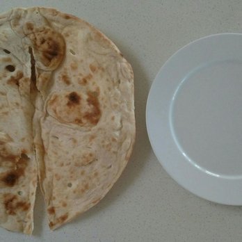 Saray Charcoal & Grill - 12" diameter pita bread next to a large dinner plate - Mediterranean Near Me - El Cajon, California Saray Charcoal & Grill - 12" diameter pita bread next to a large dinner plate - Mediterranean Near Me - El Cajon, California