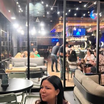 La Popular Austin - Outdoor patio, looking at some interior dining bright lights. - Mexican Near Me - Austin, Texas La Popular Austin - Outdoor patio, looking at some interior dining bright lights. - Mexican Near Me - Austin, Texas