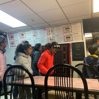 Afghan Kabob - a group of people standing around a table - Afghan Near Me - Niagara Falls, Ontario Afghan Kabob - a group of people standing around a table - Afghan Near Me - Niagara Falls, Ontario