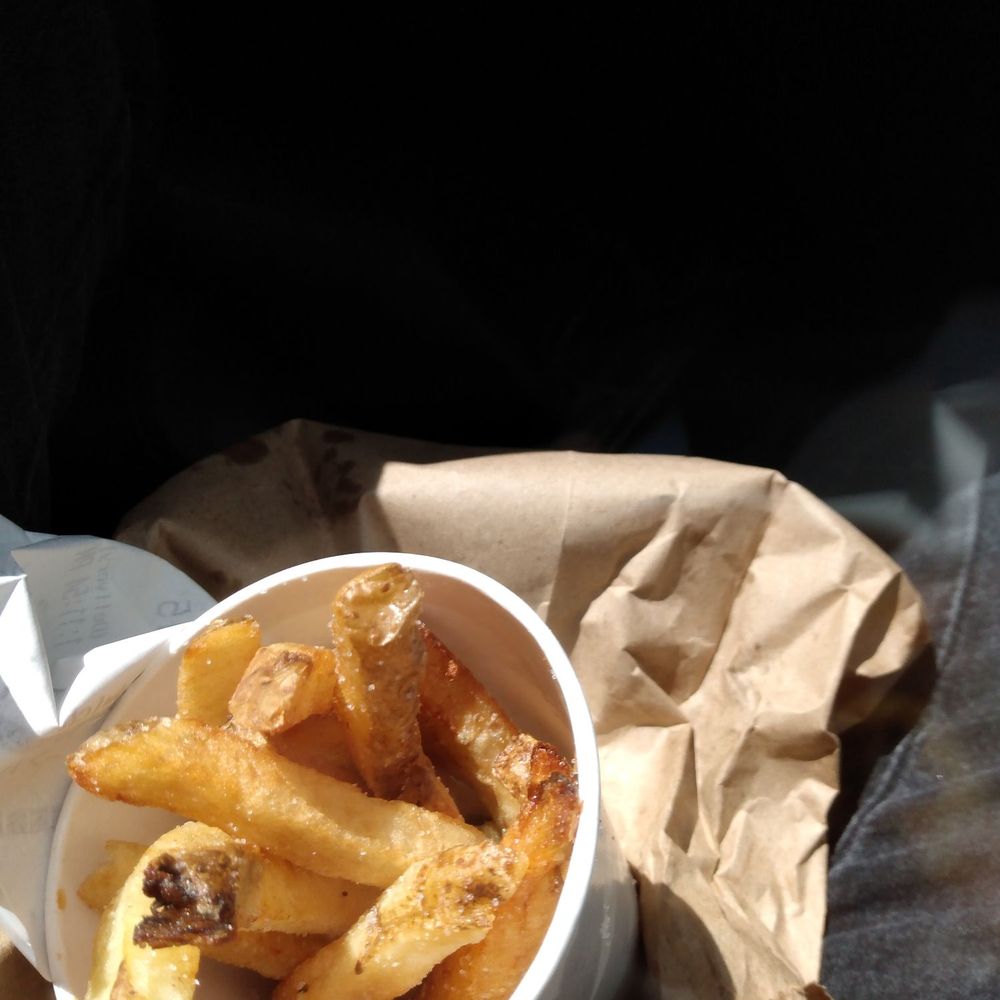 Five Guys - a bowl of french fries on a paper bag - Burgers Near Me - Santa Cruz, California Five Guys - a bowl of french fries on a paper bag - Burgers Near Me - Santa Cruz, California