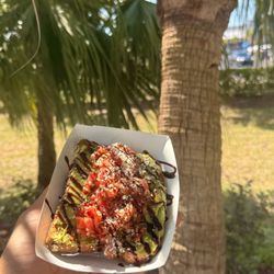 Magic Toast! Crispy protein bread topped with creamy avocado, zesty bruschetta, a drizzle of balsamic glaze, and a sprinkle of parmesan.
