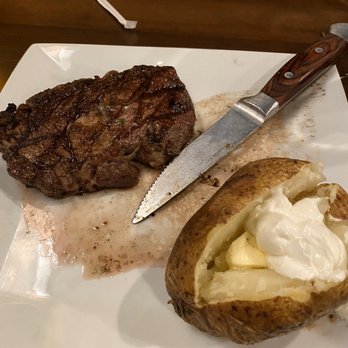 Big Sky Steak & Spirits - 10oz Rib-eye with baked potato - Steakhouses Near Me - Greensburg, Indiana