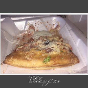 Rojas Pizza - Tonya and I ate half of our pizza slice before we remembered to take a picture.....sigh. We were "HANGRY"! - Pizza Near Me - Jacksonville, Florida