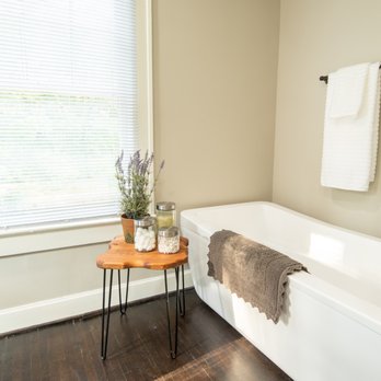 Whitaker Remodeling And Repairs - a bathtub with a towel rack - General Contractors Near Me Whitaker Remodeling And Repairs - a bathtub with a towel rack - General Contractors Near Me