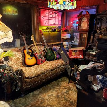 Colonial Inn & Restaurant - a living room with a couch and guitars - Bed & Breakfast Near Me - Pine Hill, New York Colonial Inn & Restaurant - a living room with a couch and guitars - Bed & Breakfast Near Me - Pine Hill, New York