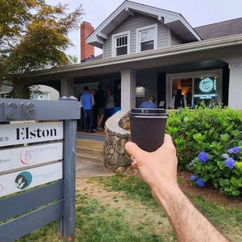 Backyard Brew - a person holding a cup of coffee in front of a house - Coffee & Tea Near Me - Charlotte , North Carolina Backyard Brew - a person holding a cup of coffee in front of a house - Coffee & Tea Near Me - Charlotte , North Carolina