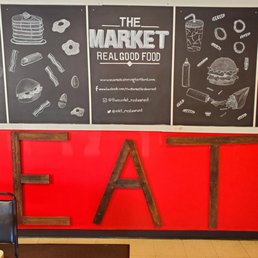 a red wall with a blackboard a red wall with a blackboard