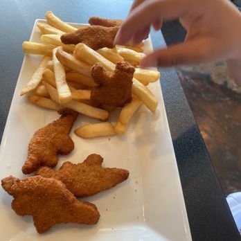 Mi Gusto Es Mexican Restaurant - Chicken nuggets with a hungry child's hand - Mexican Near Me - Gilroy, California Mi Gusto Es Mexican Restaurant - Chicken nuggets with a hungry child's hand - Mexican Near Me - Gilroy, California