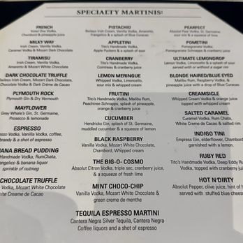 Martinis Bar & Patio - Martini menu - The menu titled 'Specialty Martinis' features a list of cocktail names with detailed ingredients and descriptions, such as 'Milky Way' with Irish cream and vanilla vodka, and 'Cucumber' with Hendricks gin and muddled cucumber. The menu is printed on white paper with black text, organized into sections with various cocktail options and their components. - Cocktail Bars Near Me - Whitman, Massachusetts