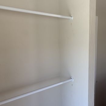 Helping Hammer - a white closet with shelves - Handyman Near Me