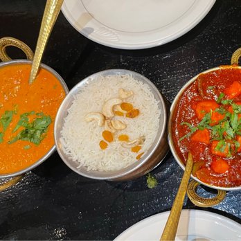 Taj of India - a variety of dishes on a table - Indian Near Me - Augusta, Georgia Taj of India - a variety of dishes on a table - Indian Near Me - Augusta, Georgia