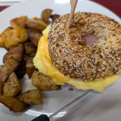 Coral Bagels - Delicious Canadian bacon, eggs and cheese on everything bagel with side of home fries