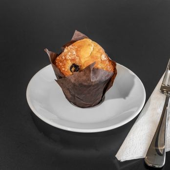 Tati - a muffin on a plate with a fork and napkin - Coffee & Tea Near Me - Madison, Wisconsin Tati - a muffin on a plate with a fork and napkin - Coffee & Tea Near Me - Madison, Wisconsin