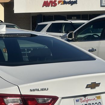 Avis - This Chevy Malibu I have rented in front of Avis storefront - Car Rental Near Me - El Cajon, California Avis - This Chevy Malibu I have rented in front of Avis storefront - Car Rental Near Me - El Cajon, California