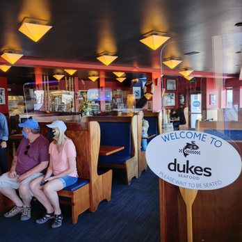 Duke's Seafood West Seattle - a couple sitting in a booth - Seafood Near Me - Seattle, Washington
