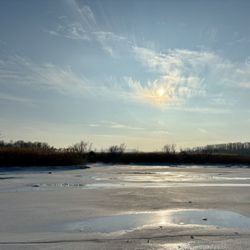 Madam Brett Park - The estuary is do open with sunlight bouncing off ice.