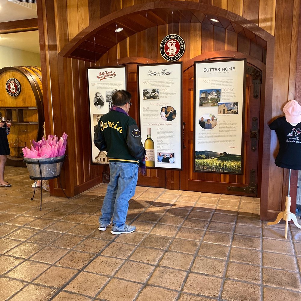 Sutter Home Winery - Someone reading up on the history of the winery - Wineries Near Me - Saint Helena, California Sutter Home Winery - Someone reading up on the history of the winery - Wineries Near Me - Saint Helena, California
