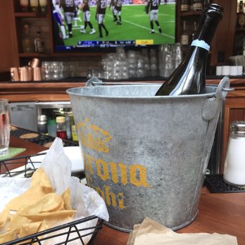 Hennessey's Tavern - Bucket of Prosecco and football...yes, ladies, you can come too!! - Bars Near Me - Laguna Beach, California
