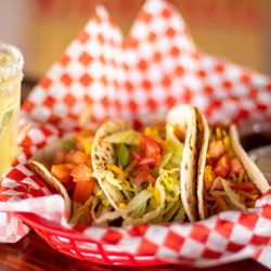 Red Barrel Bar and Grill - Our taco basket comes with three flour tortillas stuffed full of beans, beef, and veggies.  Served with sour cream and homemade salsa.