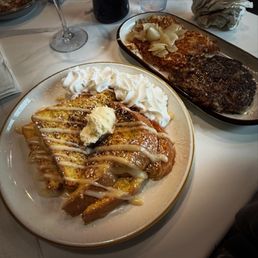 Crème brûlée french toast, shredded hash browns, monthly hot honey sausage Crème brûlée french toast, shredded hash browns, monthly hot honey sausage