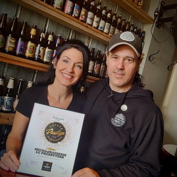 Le Presbytère - a man and a woman holding a certificate - Brewpubs Near Me - Saint-Stanislas-de-Champlain, Quebec Le Presbytère - a man and a woman holding a certificate - Brewpubs Near Me - Saint-Stanislas-de-Champlain, Quebec