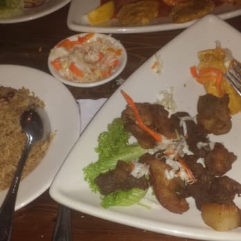 Metric Bar & Grill - Griot rice and plantains with side of picklies. - New American Near Me - Bridgeport, Connecticut