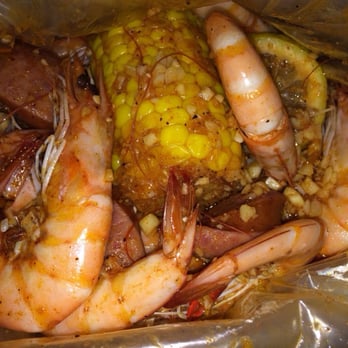 Claw Shack - Shrimp, corn and sausage soaked in Shambalang sauce. Yummy! - Cajun/Creole Near Me - San Jose, California