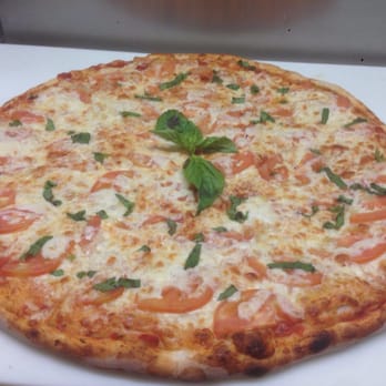 Adriano's Pizza - a cheese pizza with tomatoes and basil - Italian Near Me - Etobicoke, Ontario Adriano's Pizza - a cheese pizza with tomatoes and basil - Italian Near Me - Etobicoke, Ontario