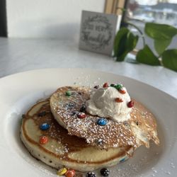 Chata’s Brunchie Cafe - Mini m&m pancakes with fresh made cream