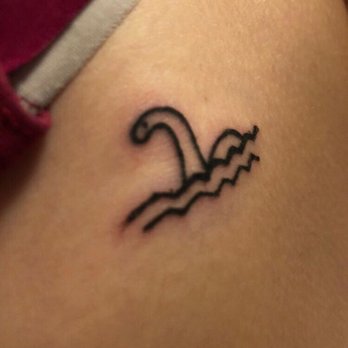 Temple Tattoo & Body Piercing - Nessie tattoo by Panther - Tattoo Near Me - Gallipolis, Ohio Temple Tattoo & Body Piercing - Nessie tattoo by Panther - Tattoo Near Me - Gallipolis, Ohio