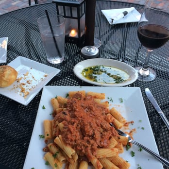 Nonna's Trattoria - Rigatoni Bolognese with crusty dinner roll and dipping sauce. Paired with Cabernet Sauvignon - Italian Near Me - St Augustine, Florida