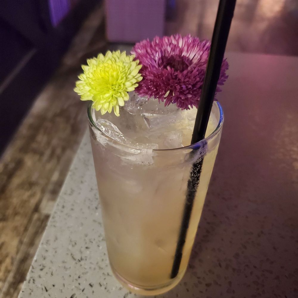 The Wildflower - a glass of lemonade with a straw - Cocktail Bars Near Me - Orlando, Florida The Wildflower - a glass of lemonade with a straw - Cocktail Bars Near Me - Orlando, Florida