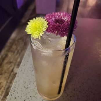 The Wildflower - a glass of lemonade with a straw - Cocktail Bars Near Me - Orlando, Florida The Wildflower - a glass of lemonade with a straw - Cocktail Bars Near Me - Orlando, Florida