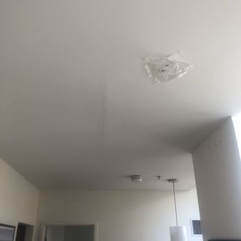 The Residences At Rodney Square - The beginning of the leak in the living room (Plastic wrap taped to the ceiling by maintenance personnel) - Apartments Near Me - Wilmington, Delaware The Residences At Rodney Square - The beginning of the leak in the living room (Plastic wrap taped to the ceiling by maintenance personnel) - Apartments Near Me - Wilmington, Delaware