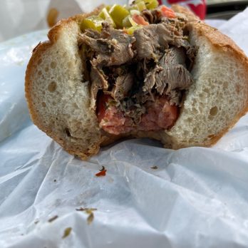 Marq's Chicago Beef - I took a bite. Omg good! Sausage is seen here. Bottom of bun is dipped in beef sauce. - Sandwiches Near Me - Toronto, Ontario