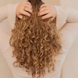 The Wig Fairy - Long curly wig from The Wig Fairy salon in Los Angeles -- high-quality wigs designed to look natural and help women feel confident again.