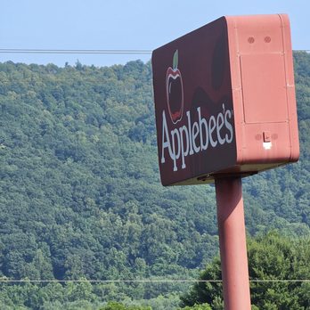Applebee's Grill + Bar - The Applebee's red sign and the green mountains behind, in the background. - American Near Me - Roanoke, Virginia Applebee's Grill + Bar - The Applebee's red sign and the green mountains behind, in the background. - American Near Me - Roanoke, Virginia