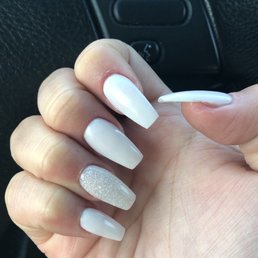 White w/ a sparkly white dip powder with tips in the shape of coffin! White w/ a sparkly white dip powder with tips in the shape of coffin!