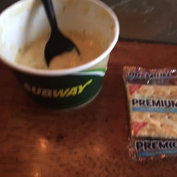 Subway - a cup of soup, crackers, and a spoon on a table - Sandwiches Near Me - Lansing, Illinois Subway - a cup of soup, crackers, and a spoon on a table - Sandwiches Near Me - Lansing, Illinois