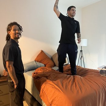 OFF-CZN - Installing the projector (I insisted on using the bed instead of them having to rearrange the room for their ladder - all is good!) - Movers Near Me