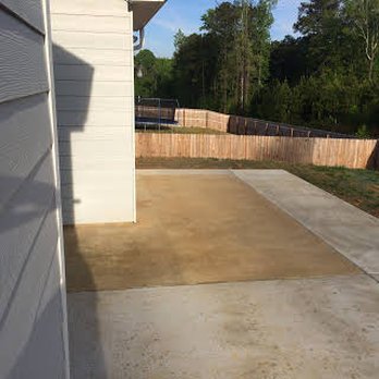 Creative Concrete & Landscape - a backyard with a concrete patio - Landscaping Near Me - Columbus, Georgia