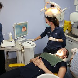 Withers Dental - One of our Hygienist Carly practicing her intra-oral scanning techniques on our another one of our Hygienist Ariane.
