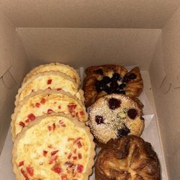 Goat cheese & red pepper quiches, (right/top to bottom) blueberry croissant, bow stock fruit & nut & their Kouign amann! Goat cheese & red pepper quiches, (right/top to bottom) blueberry croissant, bow stock fruit & nut & their Kouign amann!