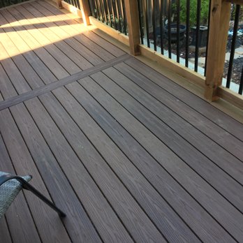 Tekton Home - a deck with chairs and railings - General Contractors Near Me Tekton Home - a deck with chairs and railings - General Contractors Near Me