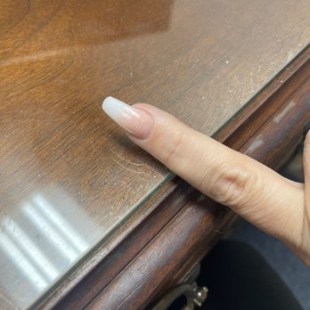 Royal Nail Spa - Large pits  in top coat .  Tech left the chair before my last coat even finished to start another client. - Nail Salons Near Me - Tallahassee, Florida