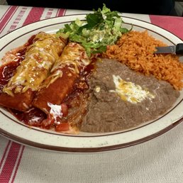 Chicken enchiladas, rice, refried beans, and salad. Chicken enchiladas, rice, refried beans, and salad.