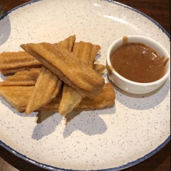 The Calaveras - Order of churros. They're good, the chocolate tequila sauce is pretty thin. - Bars Near Me - New York, New York The Calaveras - Order of churros. They're good, the chocolate tequila sauce is pretty thin. - Bars Near Me - New York, New York