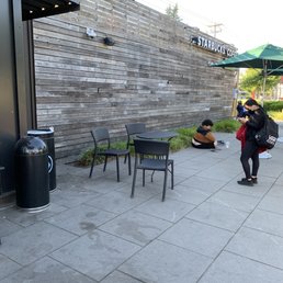 a man sitting on a bench and a woman sitting on a chair